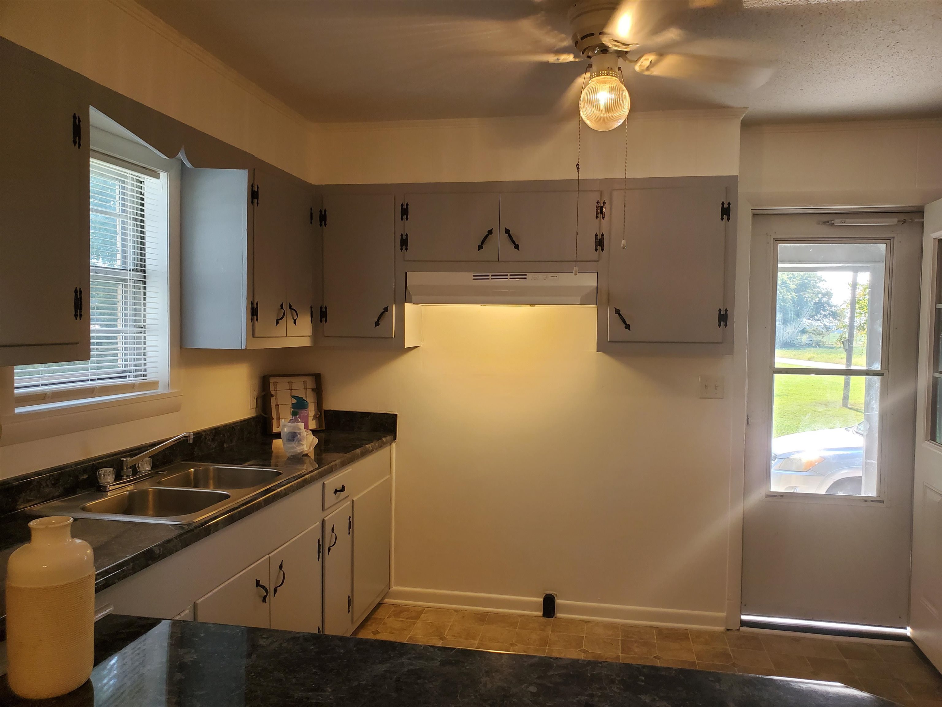 150 Dry Creek Road Toone, TN 38381 - Photo 4 of 6 a kitchen with a sink and cabinets