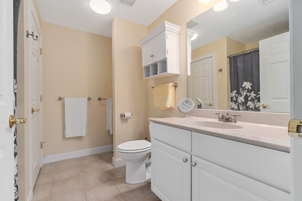 19 Broad Street, Unit 203 Merrimac, MA 01860 - Photo 13 of 20 a bathroom with a sink toilet and shower