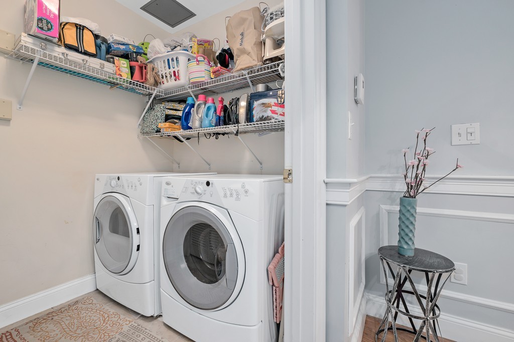 19 Broad Street, Unit 203 Merrimac, MA 01860 - Photo 18 of 20 a view of a storage and utility room with washer and dryer