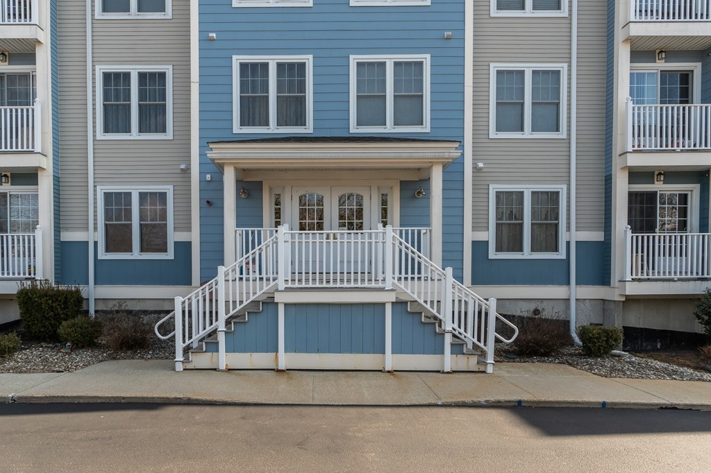 19 Broad Street, Unit 203 Merrimac, MA 01860 - Photo 19 of 20 a view of a house with a window and stairs