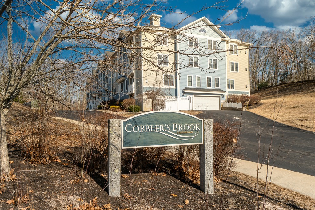 19 Broad Street, Unit 203 Merrimac, MA 01860 - Photo 20 of 20 a view of a street sign of the front of the house
