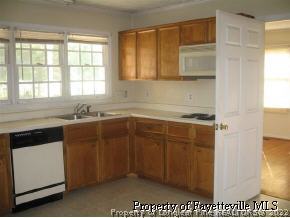 4525 Mobius Road Fayetteville, NC 28312 - Photo 4 of 4 a kitchen with a sink cabinets and a window