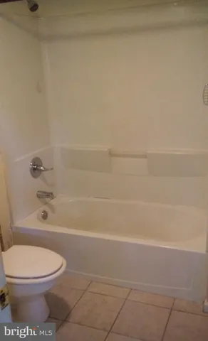a bathroom with a toilet and shower