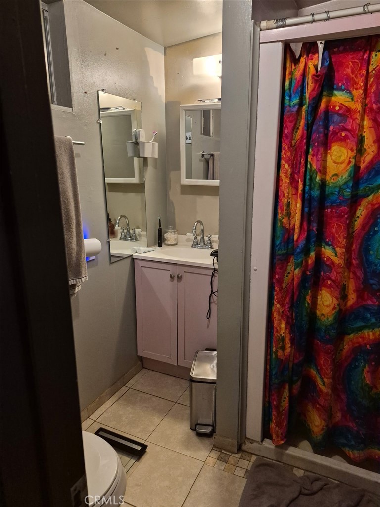 4010 Witt Avenue Riverside, CA 92501 - Photo 9 of 10 a bathroom with a sink toilet and shower