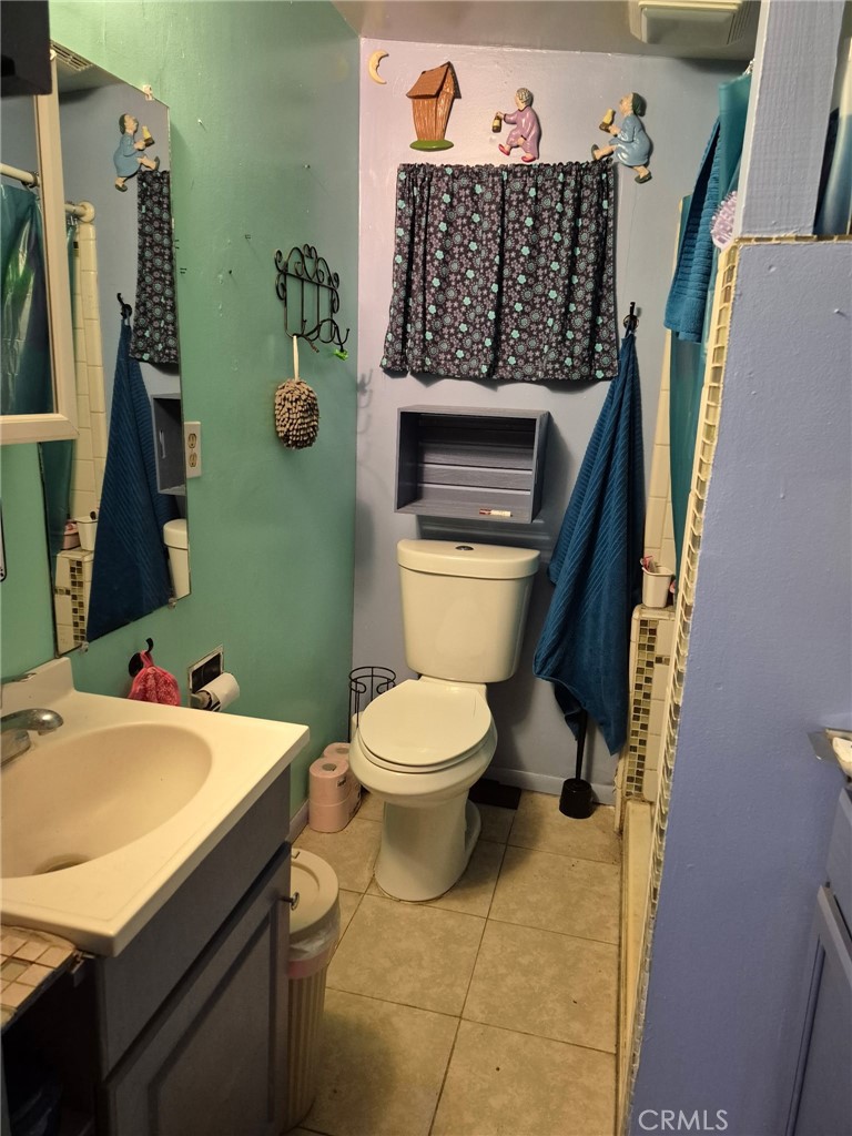 4010 Witt Avenue Riverside, CA 92501 - Photo 10 of 10 a bathroom with a sink a toilet and a mirror