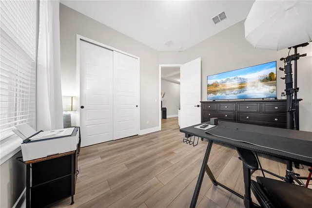 a bathroom with a double vanity sink toilet and shower
