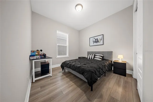 a bedroom with a bed and a dresser