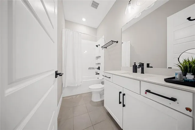 a bedroom with a bed and a cabinets