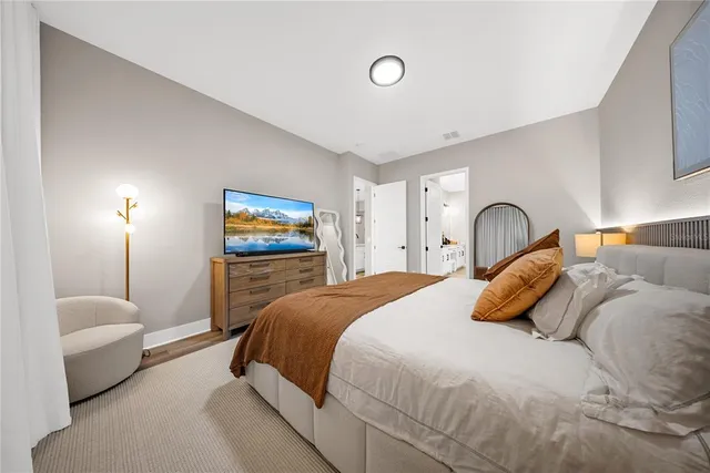 a white bath tub sitting in a bathroom next to a window