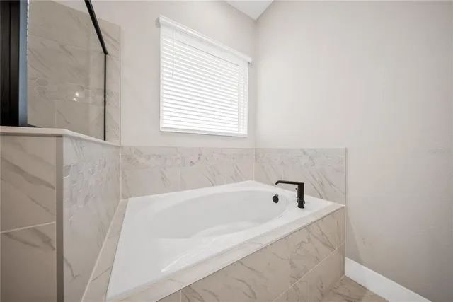 a view of a swimming pool with a terrace