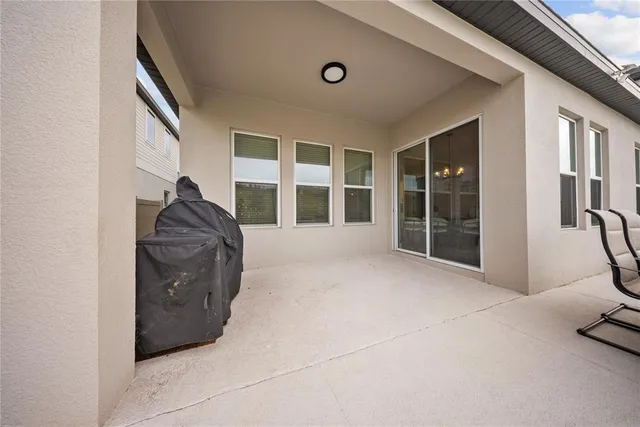 an aerial view of a house with a ocean view