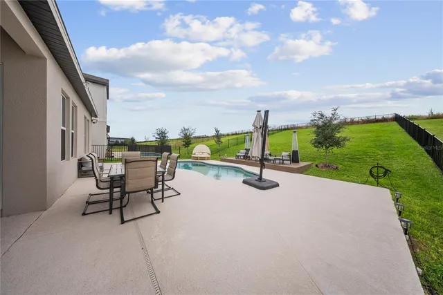 an aerial view of a residential building with parking space