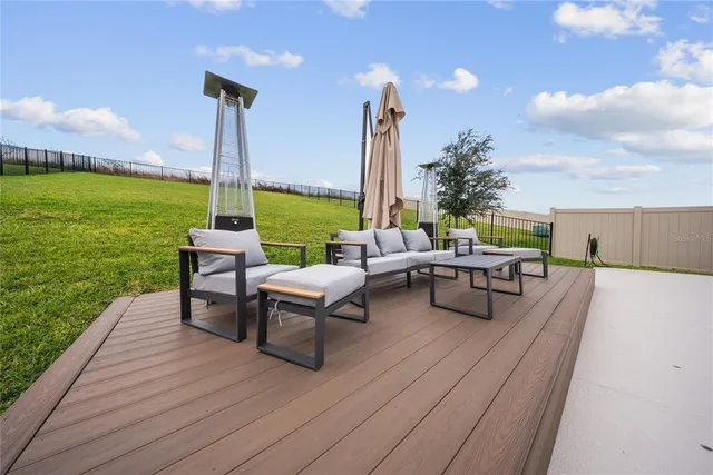 a view of large house with a big yard and large trees