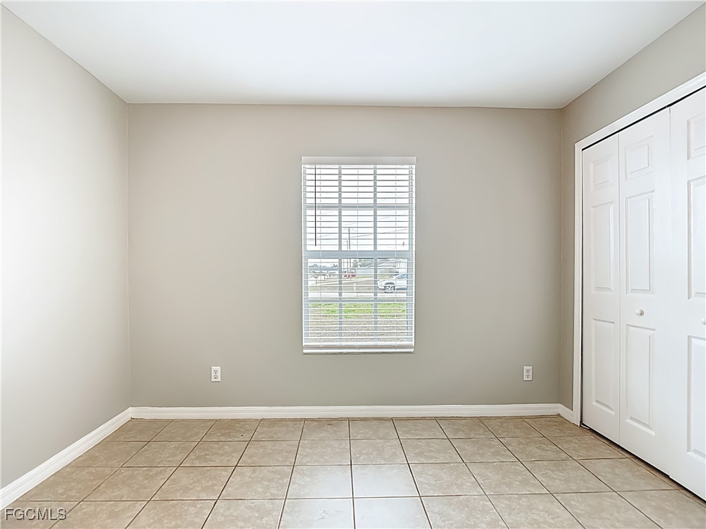 4034 29th Street Southwest Lehigh Acres, FL 33976 - Photo 13 of 22 an empty room with windows