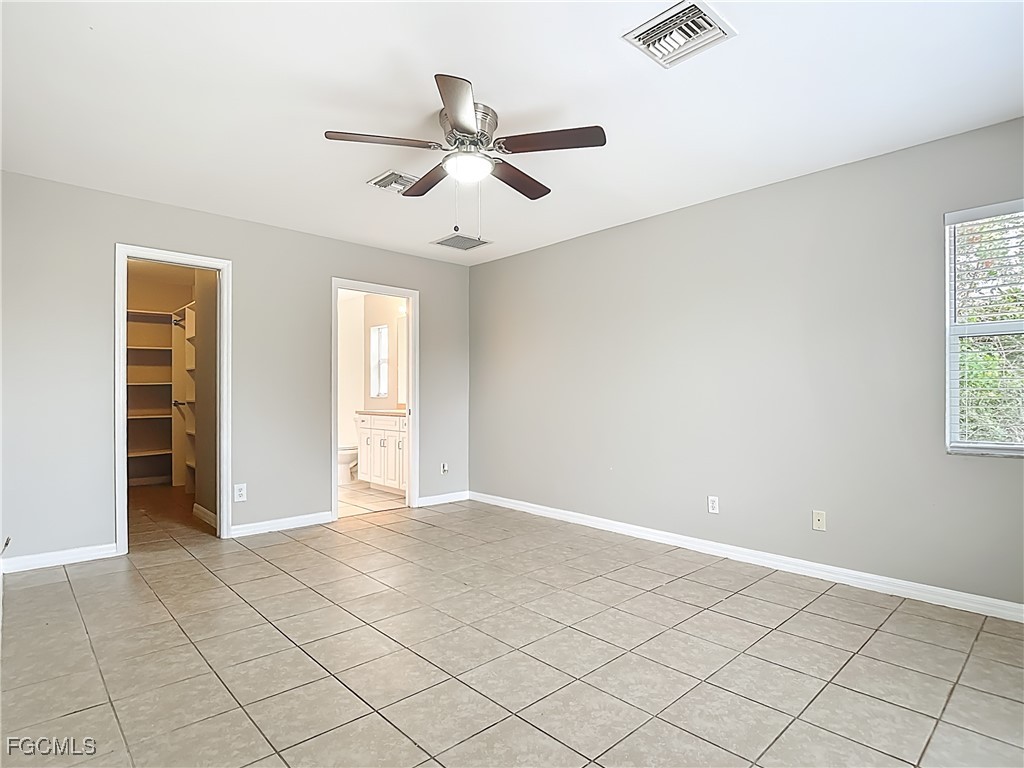4034 29th Street Southwest Lehigh Acres, FL 33976 - Photo 15 of 22 a view of an empty room with a window