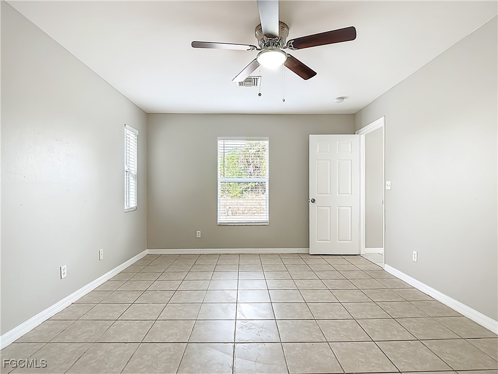 4034 29th Street Southwest Lehigh Acres, FL 33976 - Photo 16 of 22 a view of an empty room with a window