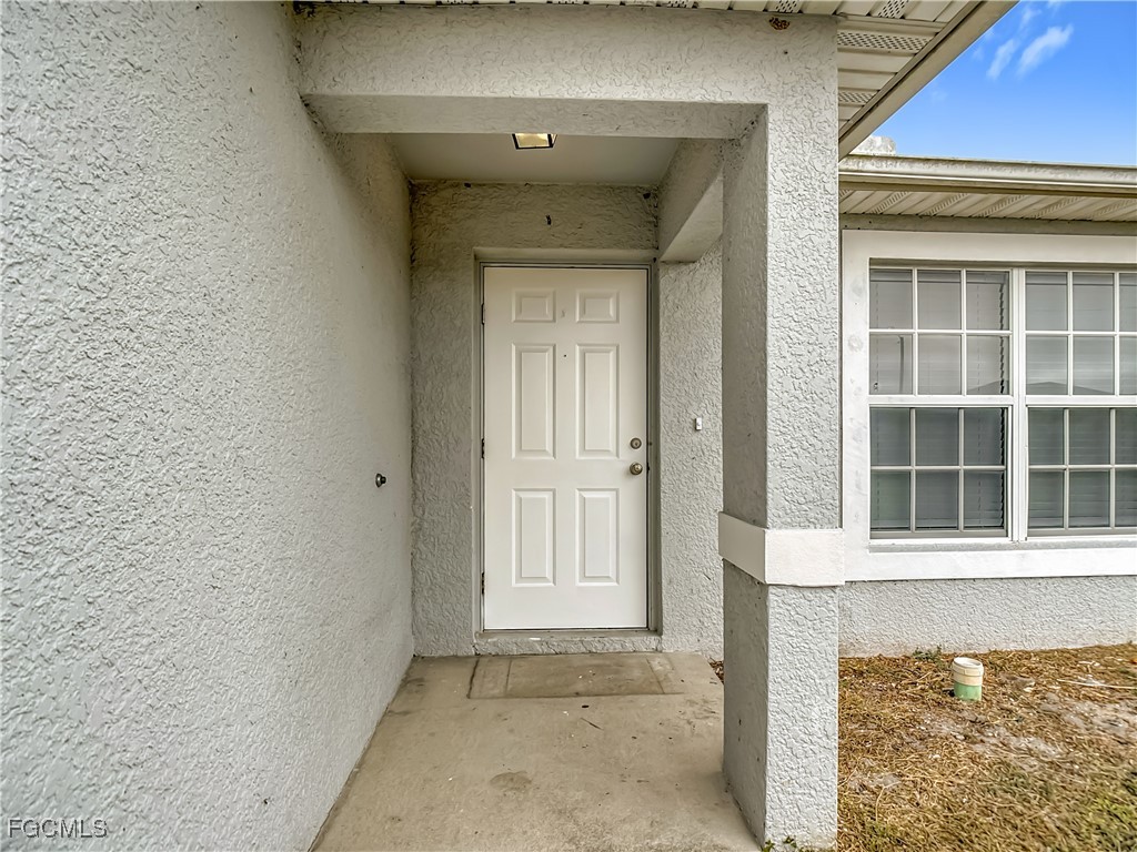 4034 29th Street Southwest Lehigh Acres, FL 33976 - Photo 2 of 22 a view of front door of a house