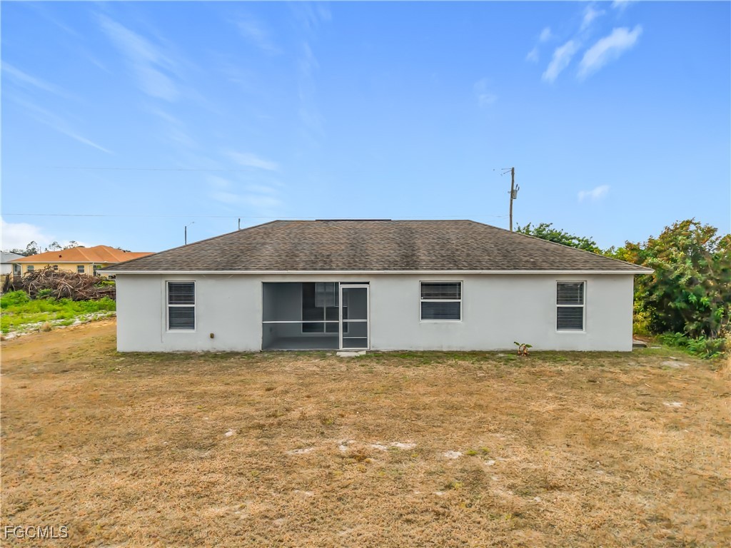 4034 29th Street Southwest Lehigh Acres, FL 33976 - Photo 22 of 22 a view of a house with a yard