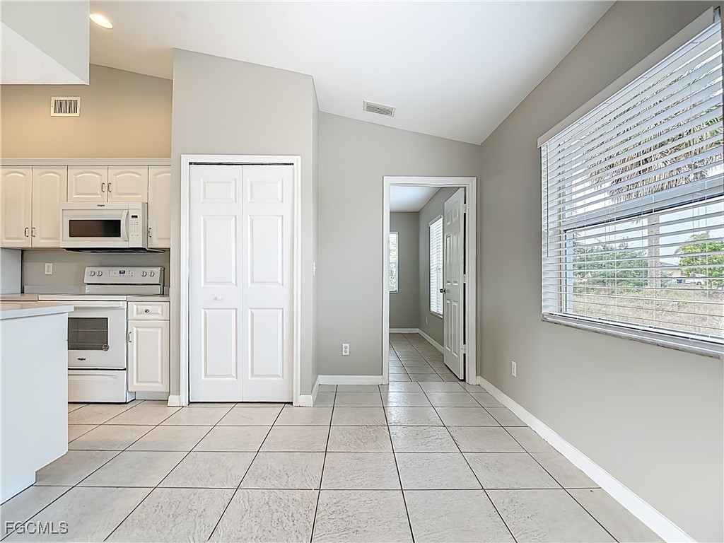 4034 29th Street Southwest Lehigh Acres, FL 33976 - Photo 10 of 22 a view of a kitchen with an empty space and a window