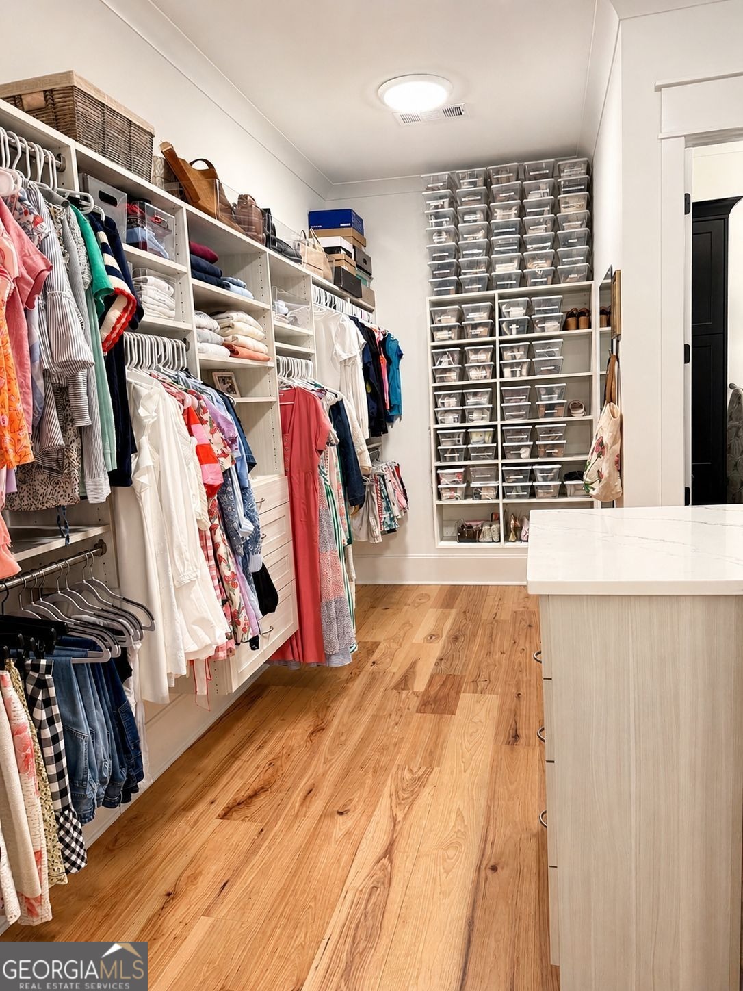 913 Indigo Bunting Road Statham, GA 30666 - Photo 18 of 31 a view of walk in closet with clothes and shoes