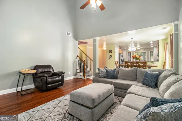 a living room with furniture and a large window