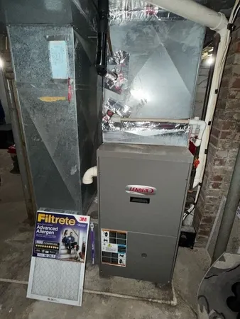 a kitchen with a refrigerator and white cabinets