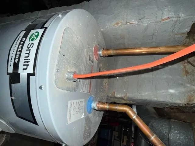 a kitchen with stainless steel appliances and white cabinets