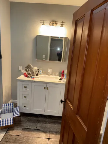 a view of a white house with a yard and garage