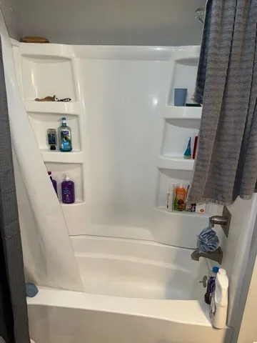 a front view of a house with parking space