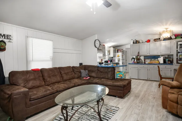 a kitchen with kitchen island granite countertop stainless steel appliances a sink and cabinets