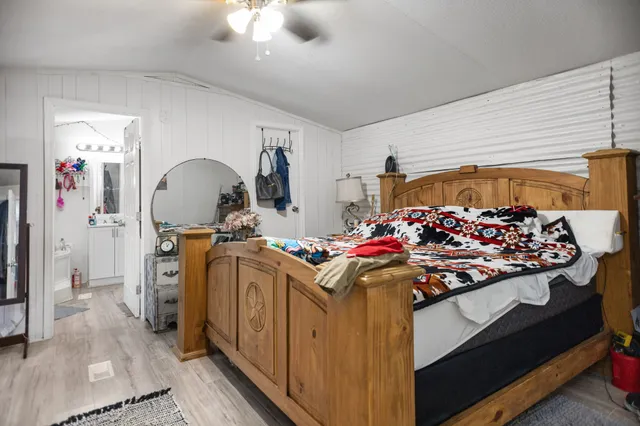 a bathroom with a bathtub sink and mirror
