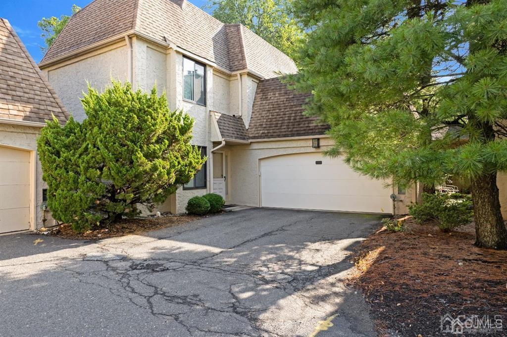 a view of a house with a yard and plants