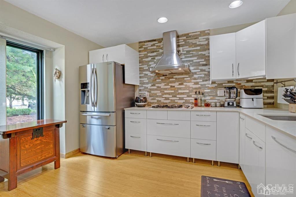 55 Gate House Lane Edison, NJ 08820 - Photo 12 of 28 a kitchen with stainless steel appliances a refrigerator sink and cabinets