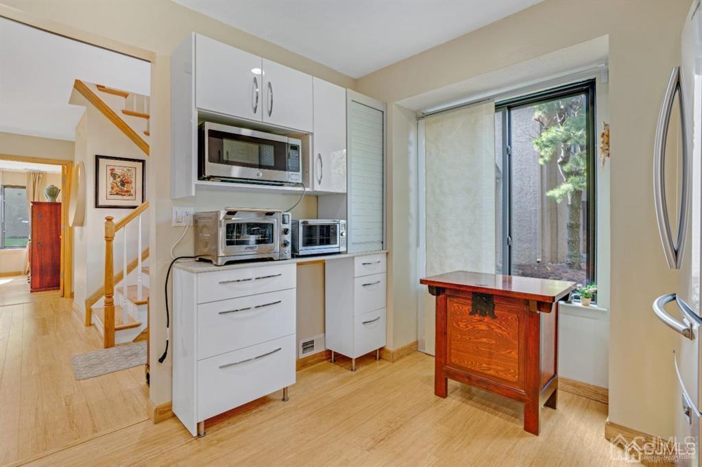 55 Gate House Lane Edison, NJ 08820 - Photo 13 of 28 a kitchen with stainless steel appliances a stove and a refrigerator