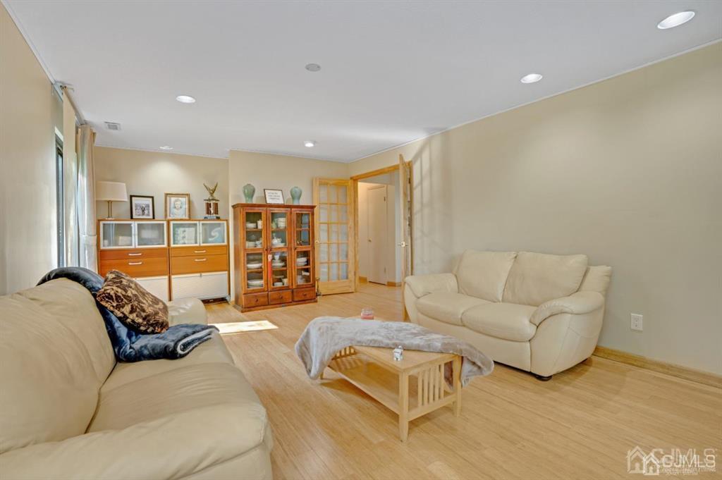 55 Gate House Lane Edison, NJ 08820 - Photo 15 of 28 a living room with furniture and a couch