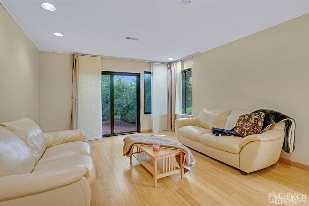55 Gate House Lane Edison, NJ 08820 - Photo 16 of 28 a living room with furniture and a large window