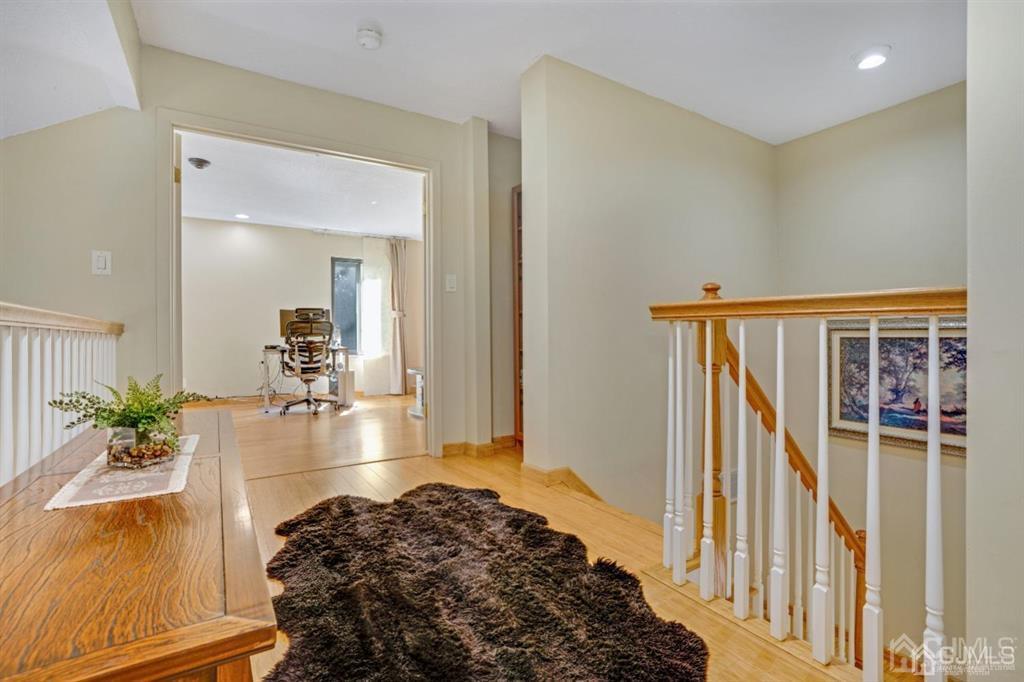 55 Gate House Lane Edison, NJ 08820 - Photo 20 of 28 a view of hallway with wooden floor and a potted plant