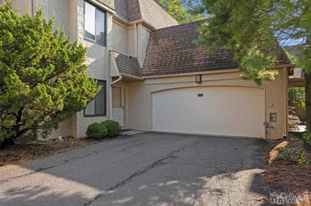 55 Gate House Lane Edison, NJ 08820 - Photo 2 of 28 a front view of a house with garden