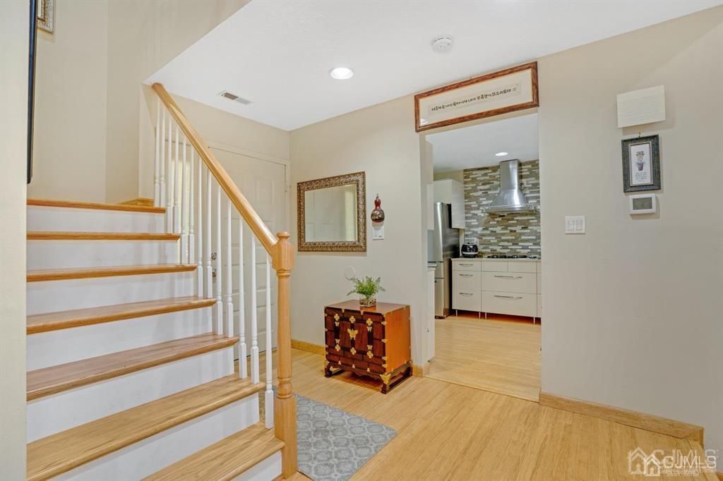 55 Gate House Lane Edison, NJ 08820 - Photo 5 of 28 a living room with furniture and a painting
