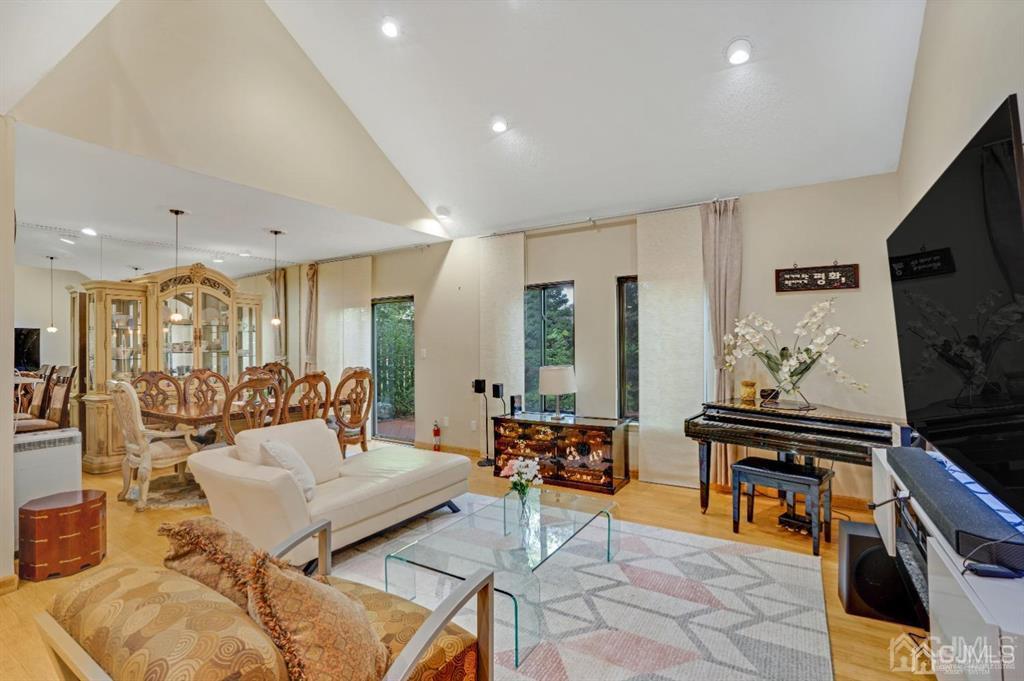 55 Gate House Lane Edison, NJ 08820 - Photo 7 of 28 a living room with furniture and a flat screen tv