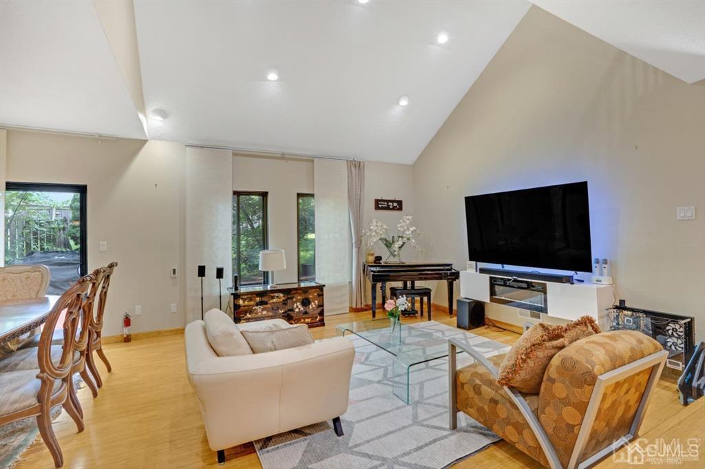 55 Gate House Lane Edison, NJ 08820 - Photo 8 of 28 a living room with furniture and a flat screen tv