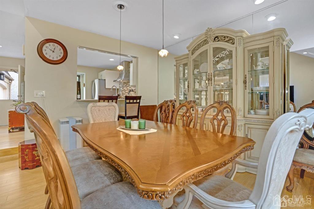 55 Gate House Lane Edison, NJ 08820 - Photo 10 of 28 a dining room with wooden floor