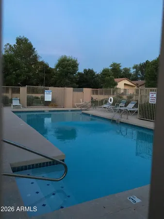a view of a swimming pool with a patio