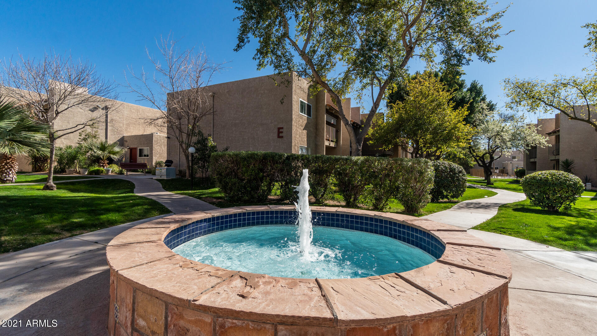 5525 East Thomas Road, Unit F14 Phoenix, AZ 85018 - Photo 15 of 20 a view of a fountain in the front of a house