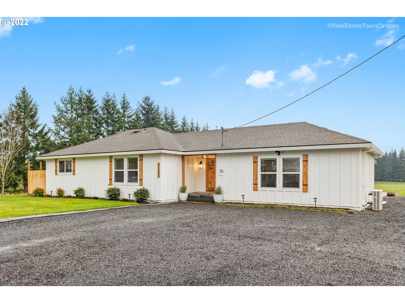 31980 Southwest Unger Road Cornelius, OR 97113 - Photo 2 of 9 a view of a house with a backyard and porch