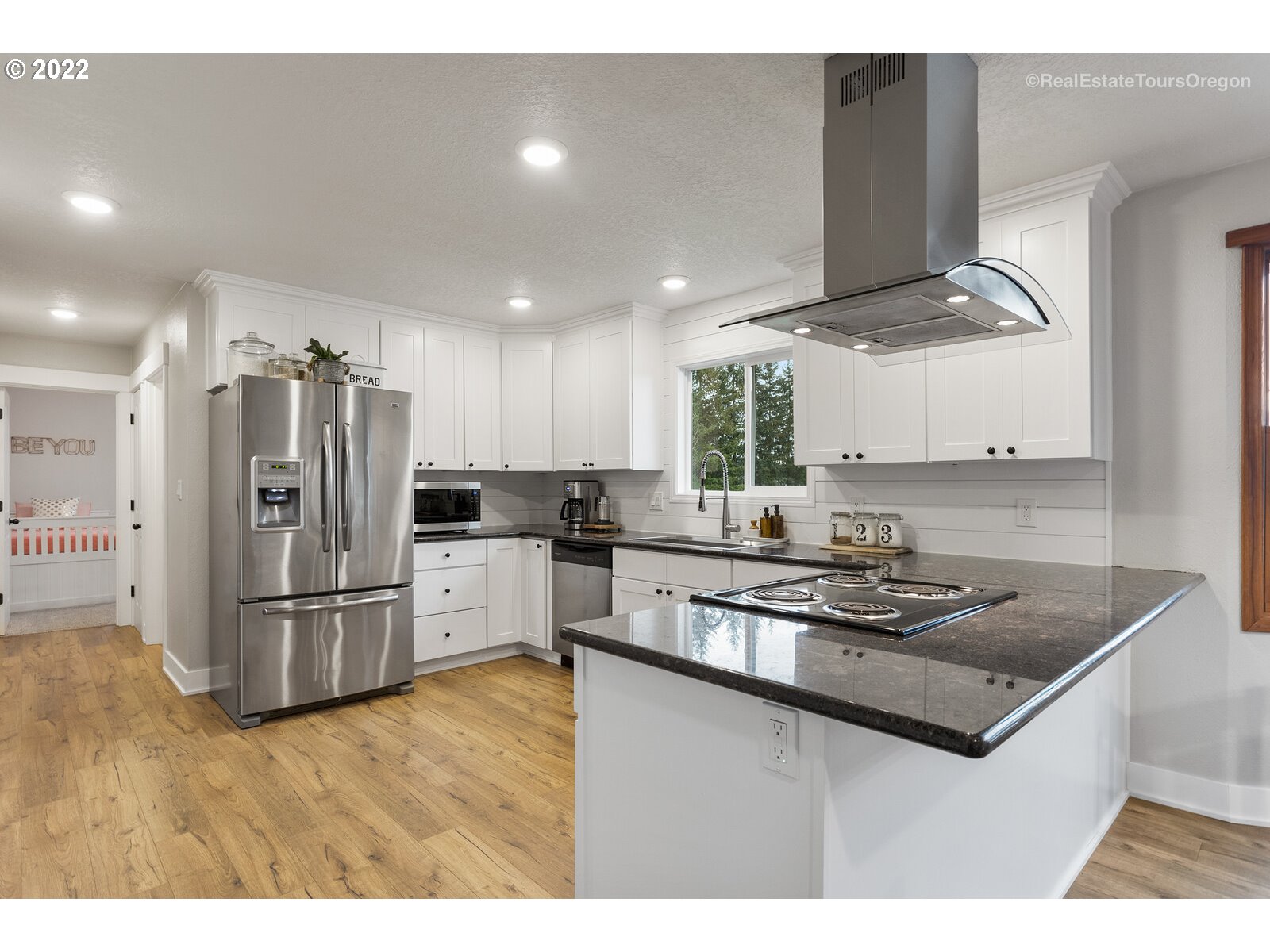 31980 Southwest Unger Road Cornelius, OR 97113 - Photo 7 of 9 a kitchen with stainless steel appliances granite countertop a refrigerator a stove and a sink