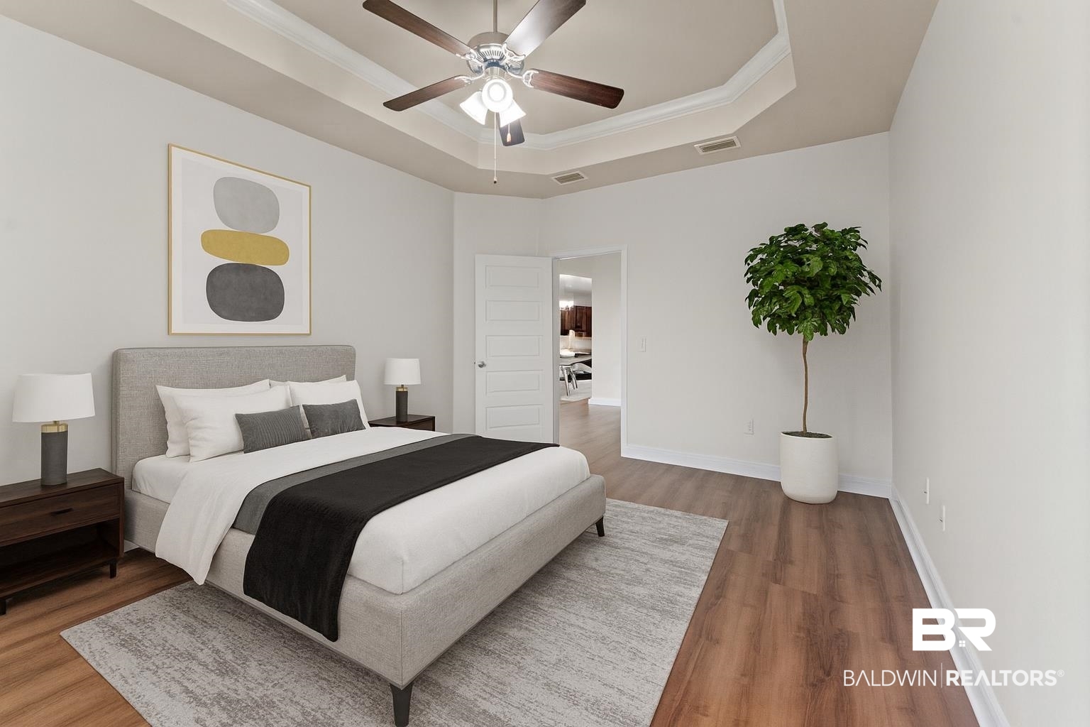 1464 Surrey Loop Foley, AL 36535 - Photo 15 of 24 Bedroom featuring a tray ceiling, ornamental molding, wood finished floors, and a ceiling fan