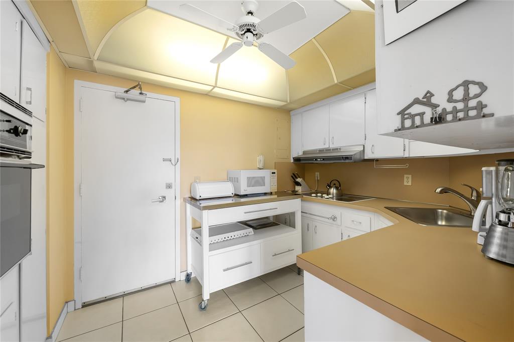 3700 Galt Ocean Drive, Unit 714 Fort Lauderdale, FL 33308 - Photo 15 of 39 a kitchen with a sink cabinets and appliances