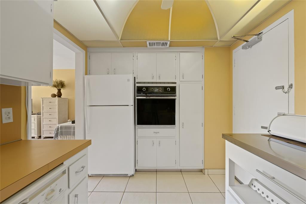 3700 Galt Ocean Drive, Unit 714 Fort Lauderdale, FL 33308 - Photo 17 of 39 a kitchen with stainless steel appliances a refrigerator and a sink