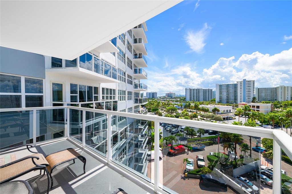 3700 Galt Ocean Drive, Unit 714 Fort Lauderdale, FL 33308 - Photo 2 of 39 a view of a chair and tables in the balcony